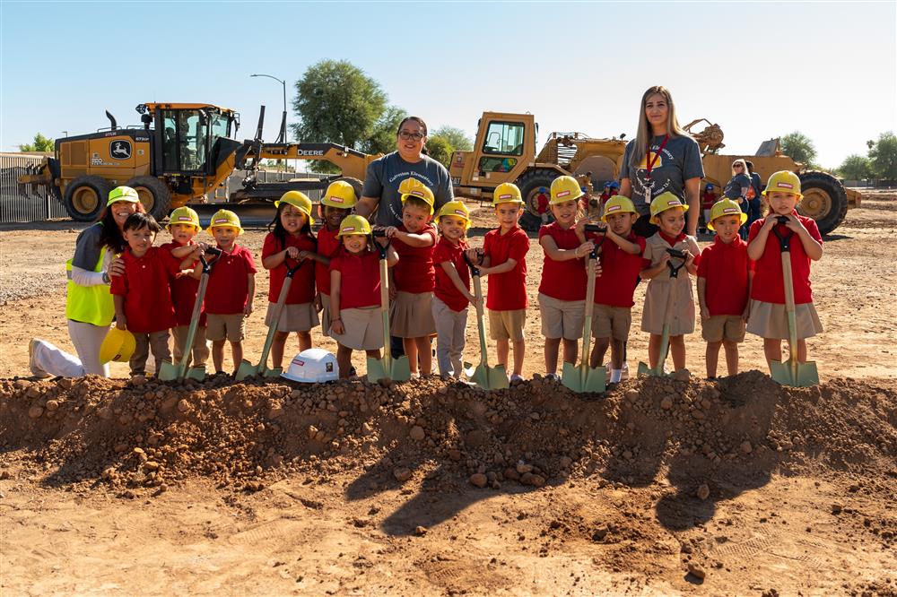 Pre-K students pose for a photo with their teachers